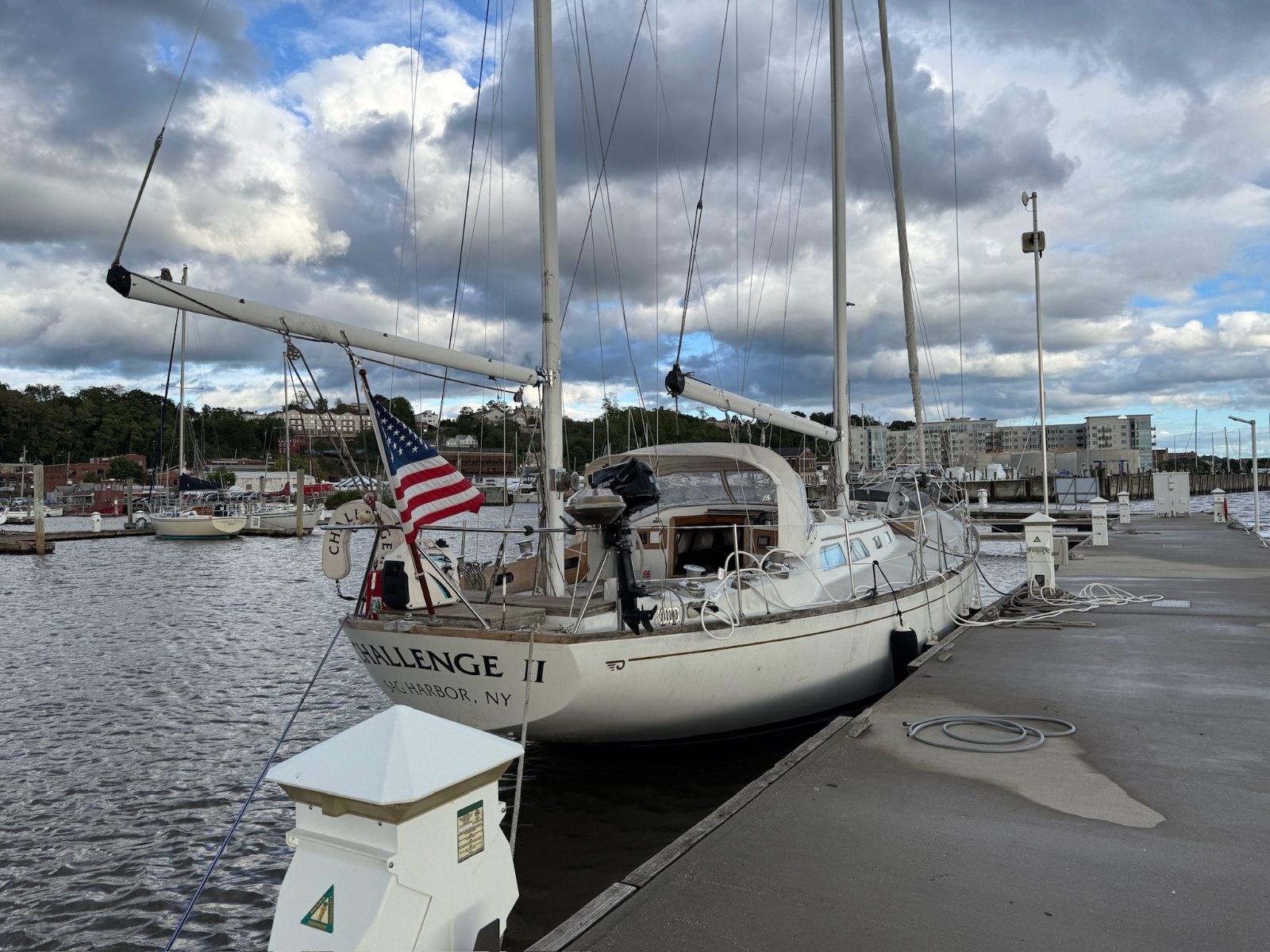 A classic yawl alongside a marina dock